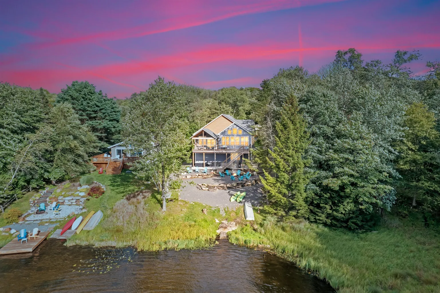 Twilight aerial view of the Arrowhead Lake home Ideal manages